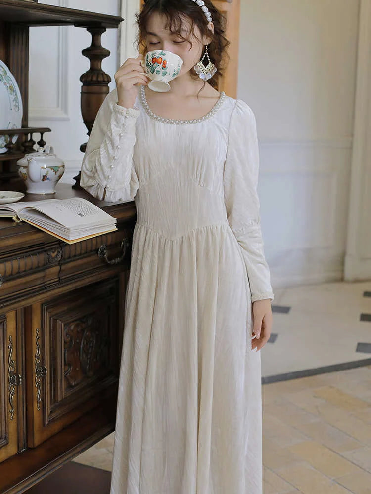 Elegant Pearl-Trimmed Ivory Long Dress